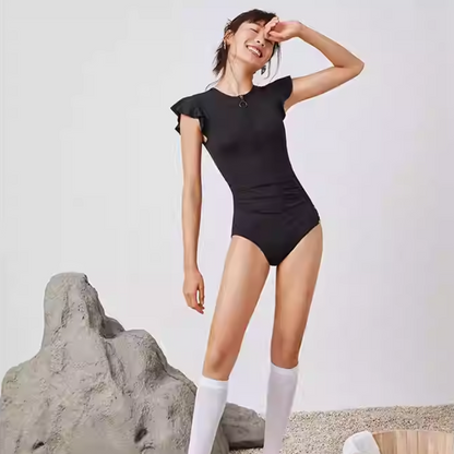 SBSS211W18P7B -Women's stylish black swimsuit with flattering belly design, showcasing European and American curves for a slimming effect.